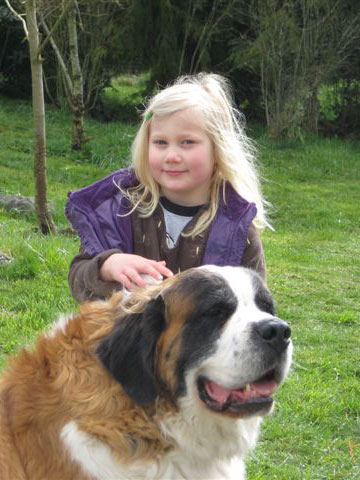 Young girl standing with Buster